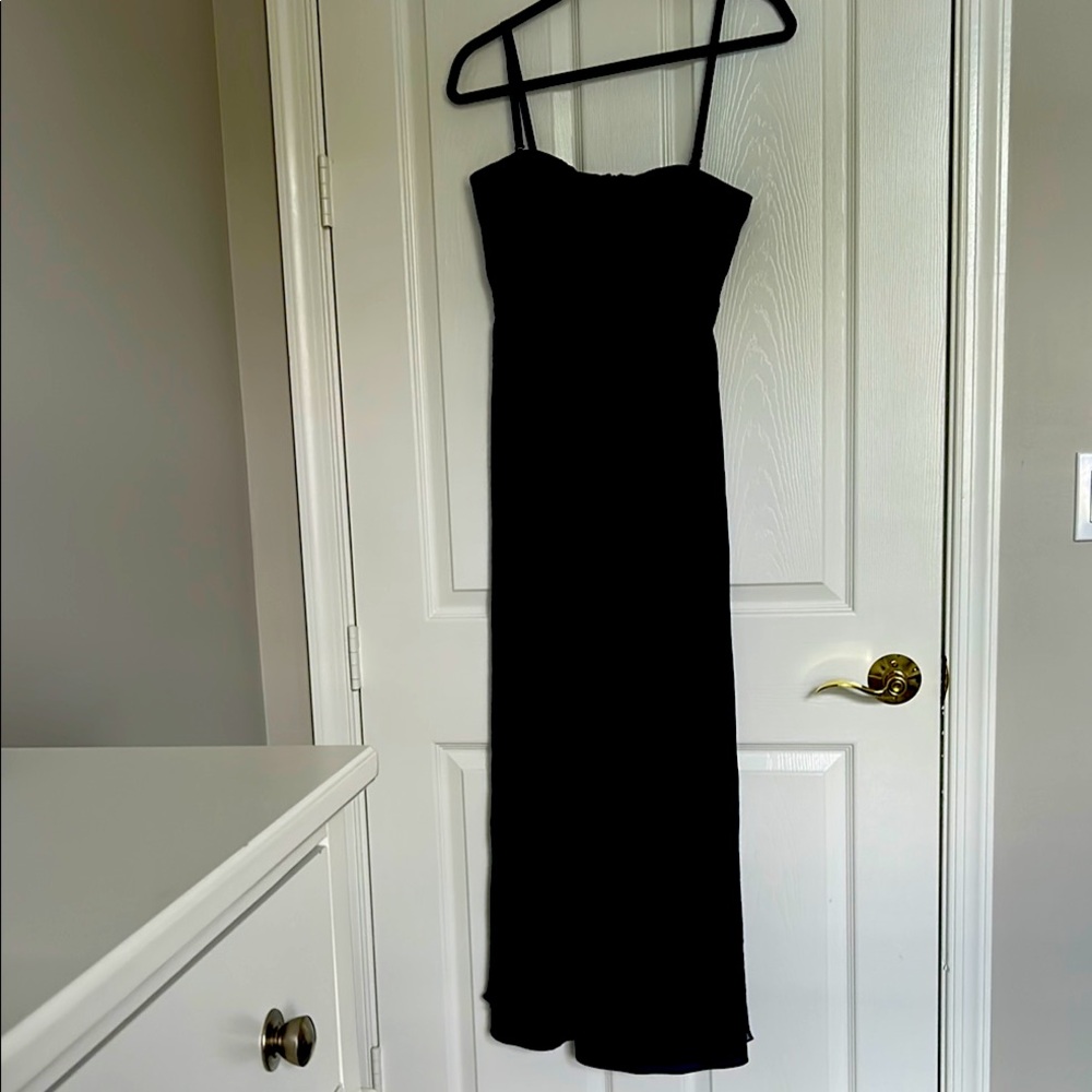 Simple yet elegant blue with black trim strapless gown .